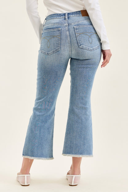 Judy Blue MR Kick Flare Jeans w/ Frayed Hem, light blue, available in sizes 24-32.