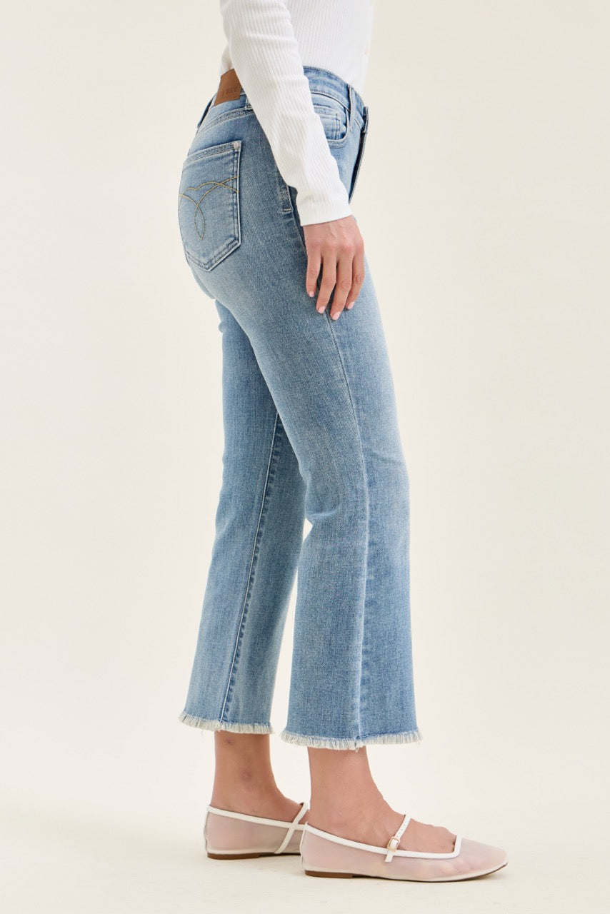 Judy Blue MR Kick Flare Jeans, light blue with frayed hem. Available in sizes 24-32.