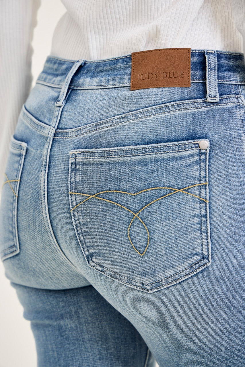 Judy Blue MR Kick Flare Jeans, light blue, frayed hem, ultra-stretchy denim, decorative stitching, sizes 24–32.