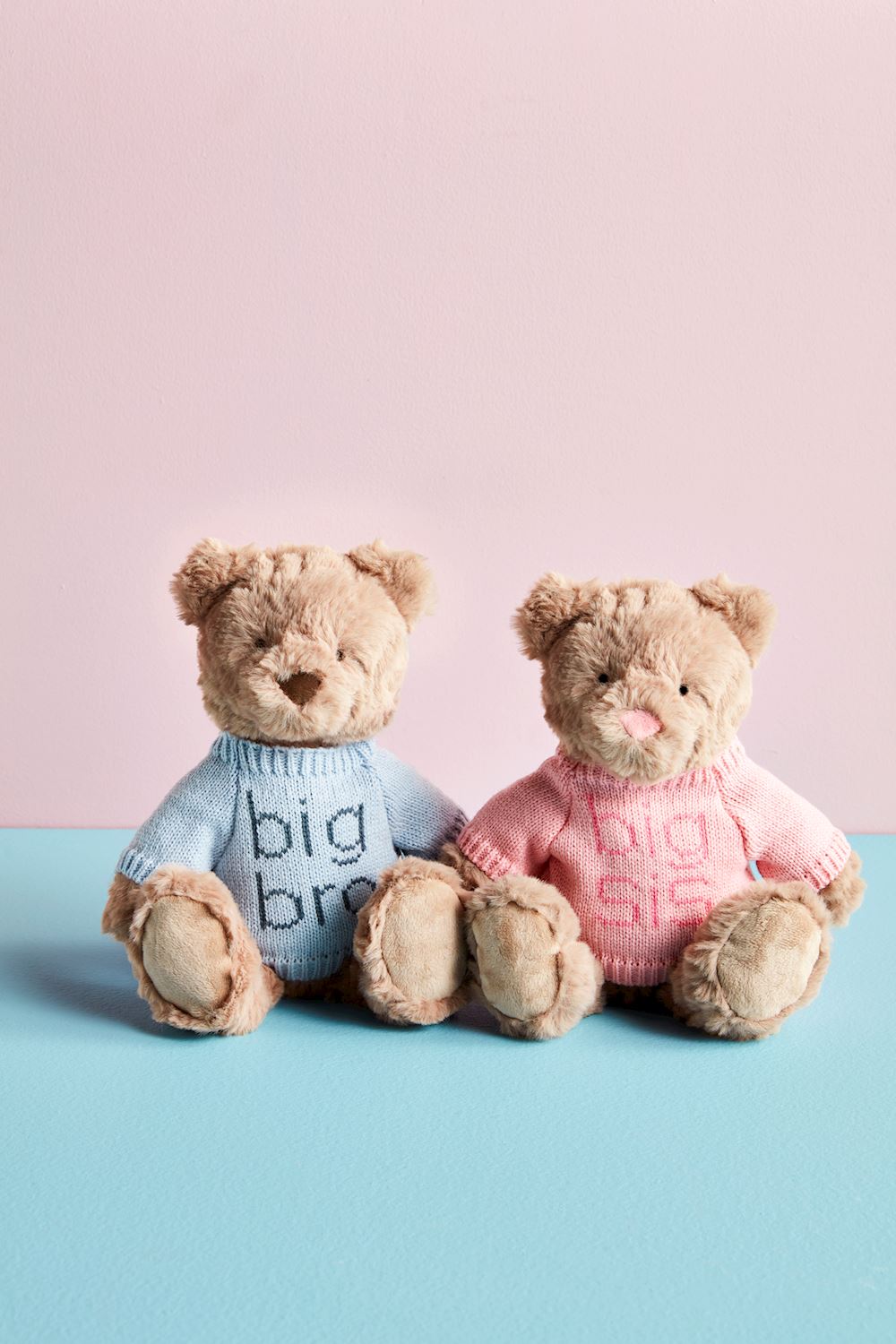 Set of two faux fur Big Sibling Plush Bears in "big bro" and "big sis" sweaters. Available in small and large sizes.