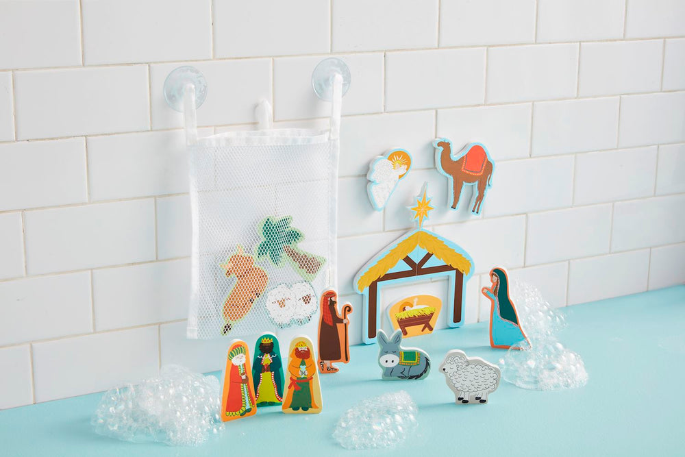 Nativity-themed Christmas bath foam shapes with stable, manger, figures, animals, and mesh storage bag.