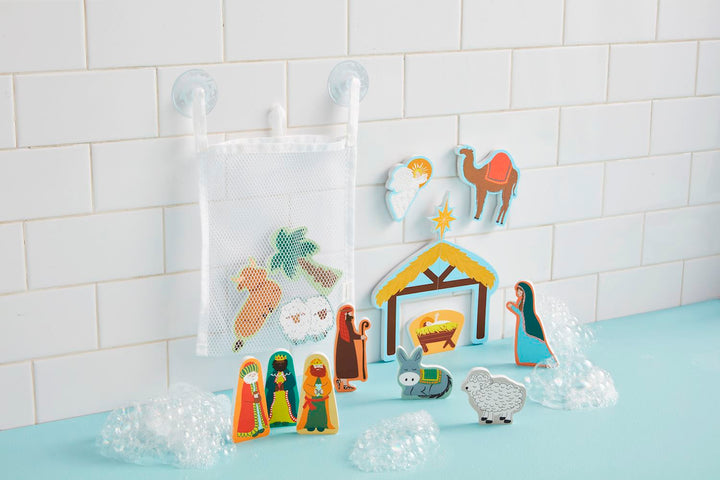 Nativity-themed Christmas bath foam shapes with stable, manger, figures, animals, and mesh storage bag.