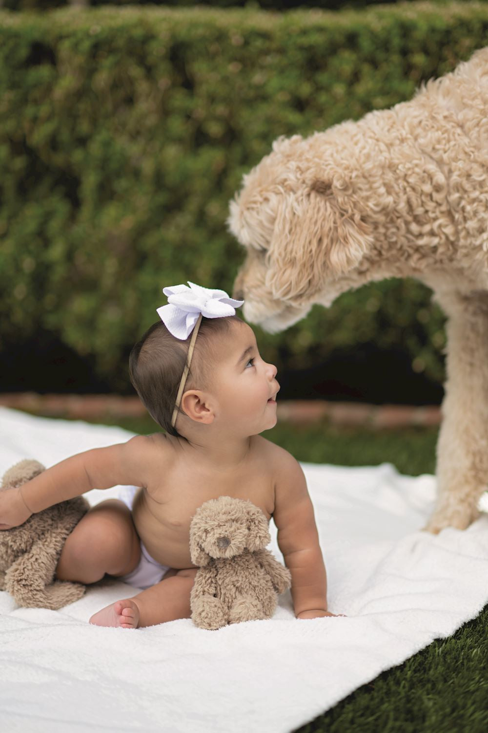 Swaddle & Rattle Set shown in use. Available in sizes S, M, and L.