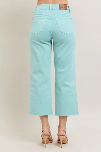 Judy Blue HW Garment Dyed Light Sky Blue Crop Wide Jeans feature frayed hems and a high-waisted design. Sizes available: 0/24 to 24W.