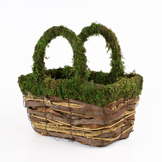 The Dorothy Moss Basket is a stylish storage item made from wicker and twigs, featuring green moss and matching looped handles. Available sizes: Small, Medium, Large.