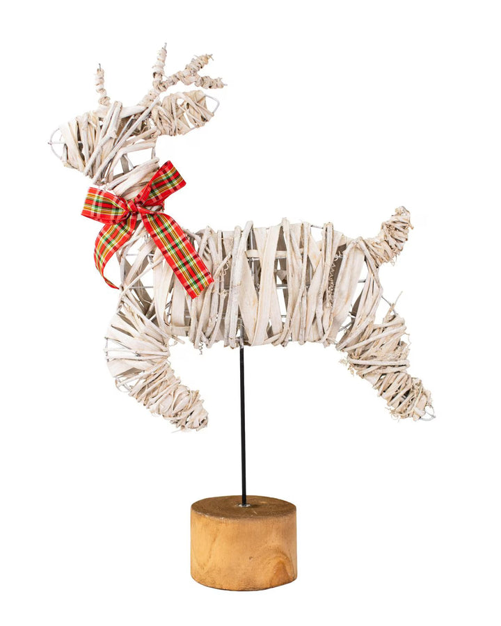 Woven wood Vixen Leaping Deer holiday decor with plaid bow on wooden base.