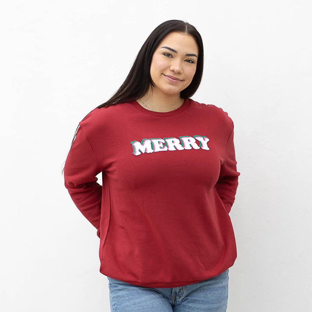 Merry Sweatshirt: red crewneck holiday sweatshirt with white, red, and green “MERRY” lettering. Sizes available.