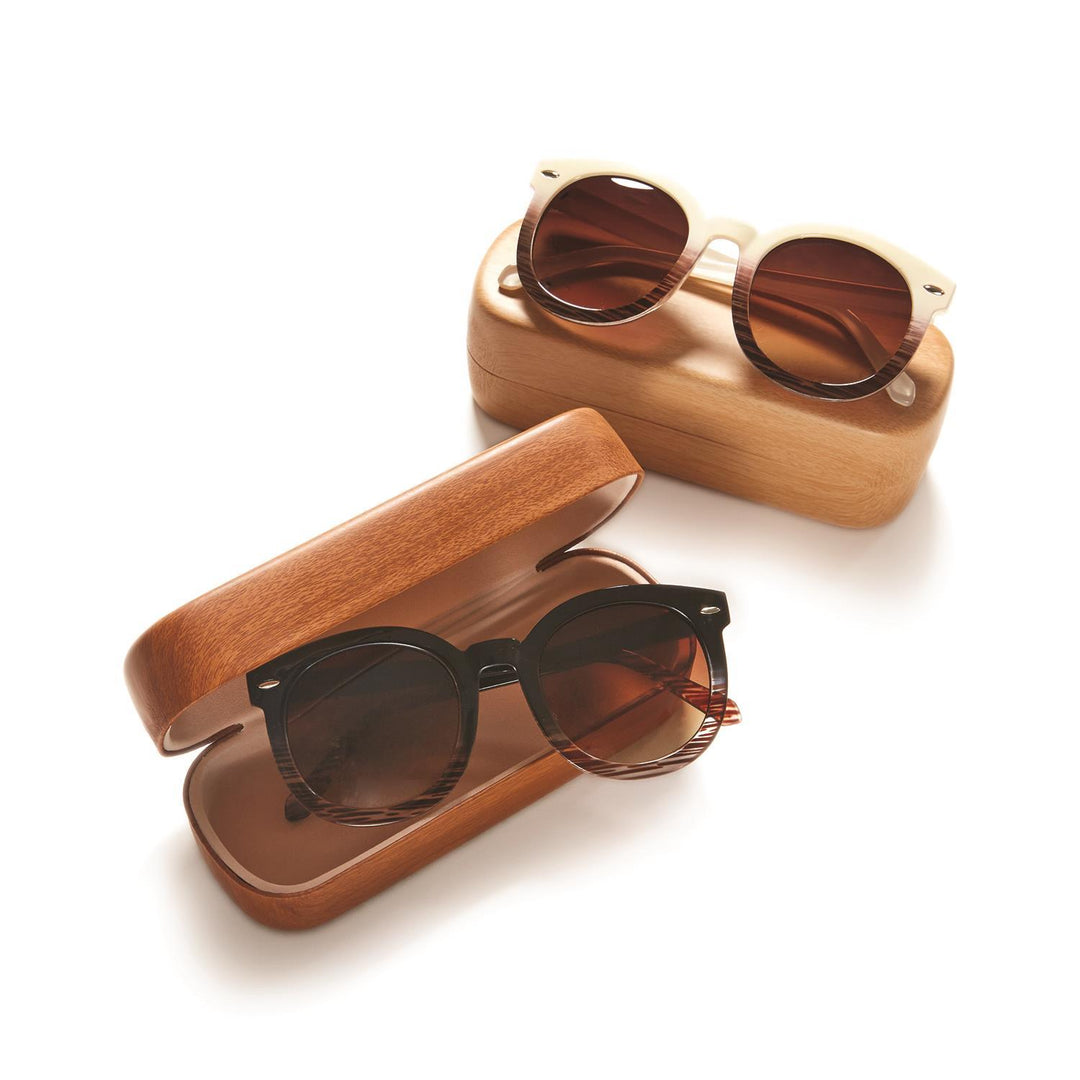 Two pairs of Fade Frame Sunglasses, cream and black, each with a case. Available in sizes S, M, L.