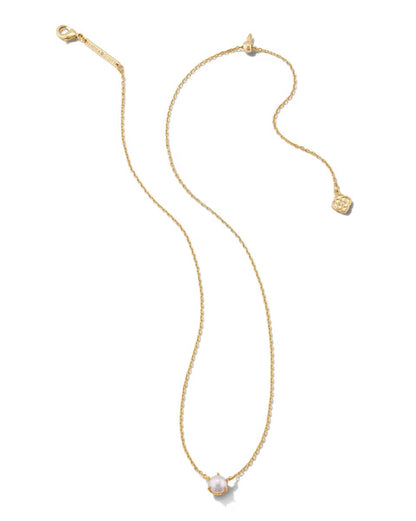 The Ashton Pearl Necklace by Kendra Scott: gold chain, single white pearl pendant, small gold tag; available in 16"–18".