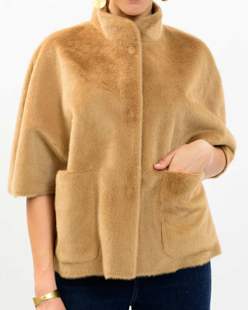Tan Arabella Faux Fur Capelet with high collar, elbow-length sleeves, and two front pockets.