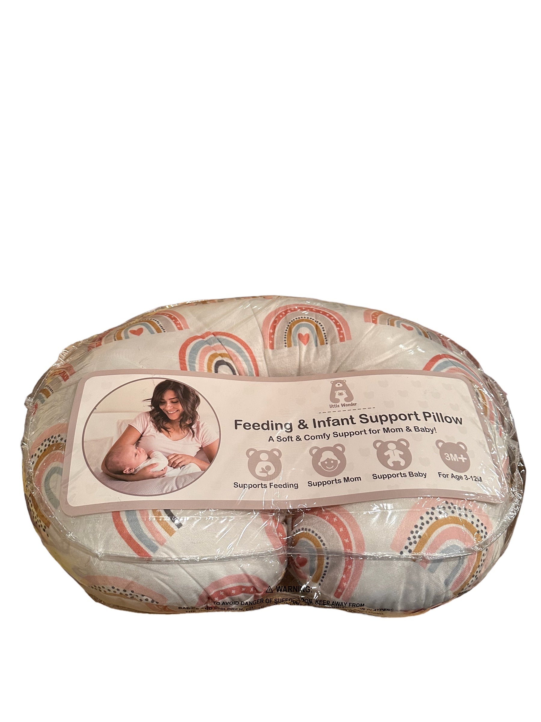 feeding and infant support pillow featuring rainbows