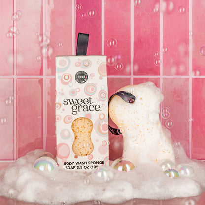 Sweet Grace Body Wash Sponge and box in bubbly foam. Available sizes: regular, large. Exfoliating, single item shown.