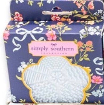 Floral-patterned box labeled “simply southern” contains a light blue, textured silicone Makeup Brush Cleanser pad visible through a clear window. Sizes available: not specified.