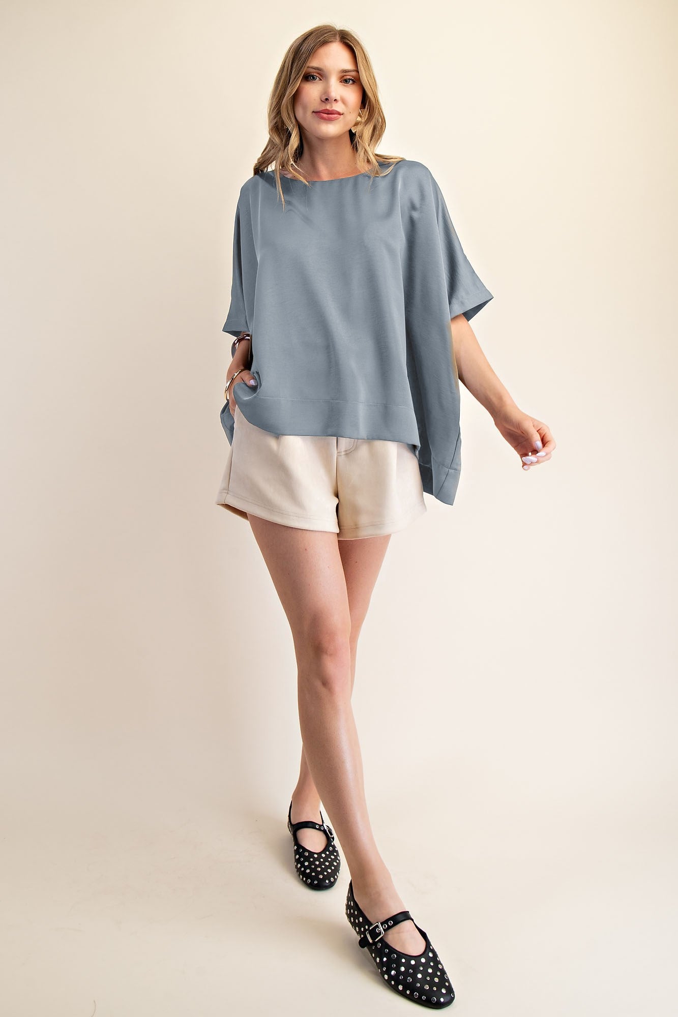Slate gray round neck oversized top. Available in sizes XS–XL.