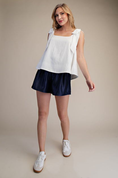 White Scoop Neck Bow Shoulder Top; available in sizes XS–XL. Features bow detail at shoulders and a spring-ready design.