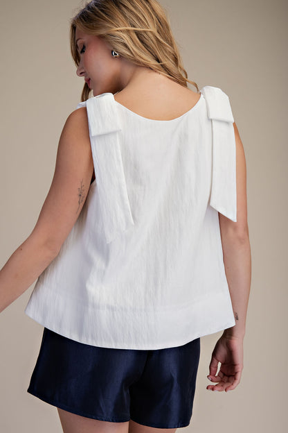White Scoop Neck Bow Shoulder Top, features bow details on shoulders. Available in sizes XS-XL.