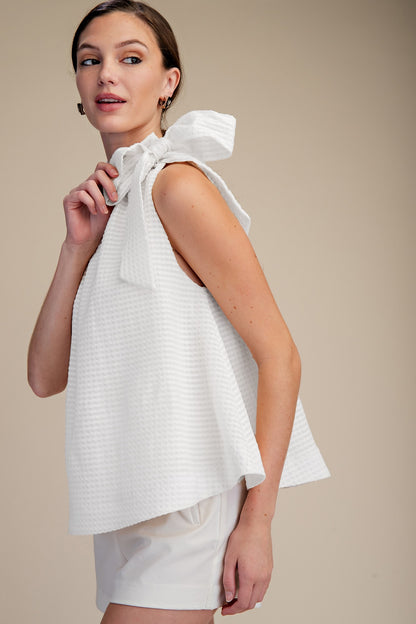 White Ruffle Neck Tie Sleeveless Top with ruffled neckline, available in sizes XS–L.