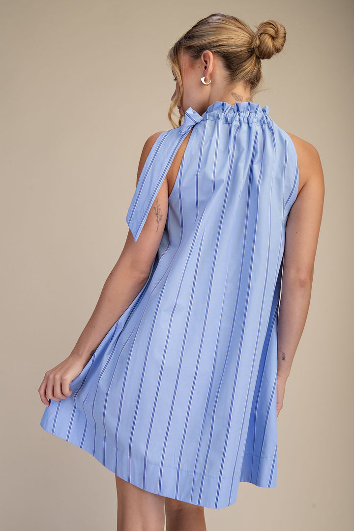 Pinstripe Blue Tie-Neck Sleeveless Dress with flared skirt. Available in sizes XS-XL.