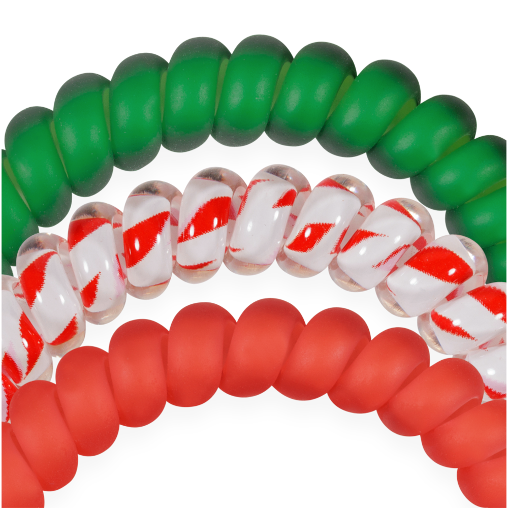 Set of three small spiral hair ties in solid green, candy cane striped, and solid red.