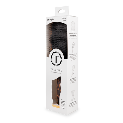 Boxed Detangler Hair Brush for Thick Hair - Tortoise, with black bristles and a tortoiseshell handle, product logo and feature illustrations on white packaging; available in standard and large sizes.