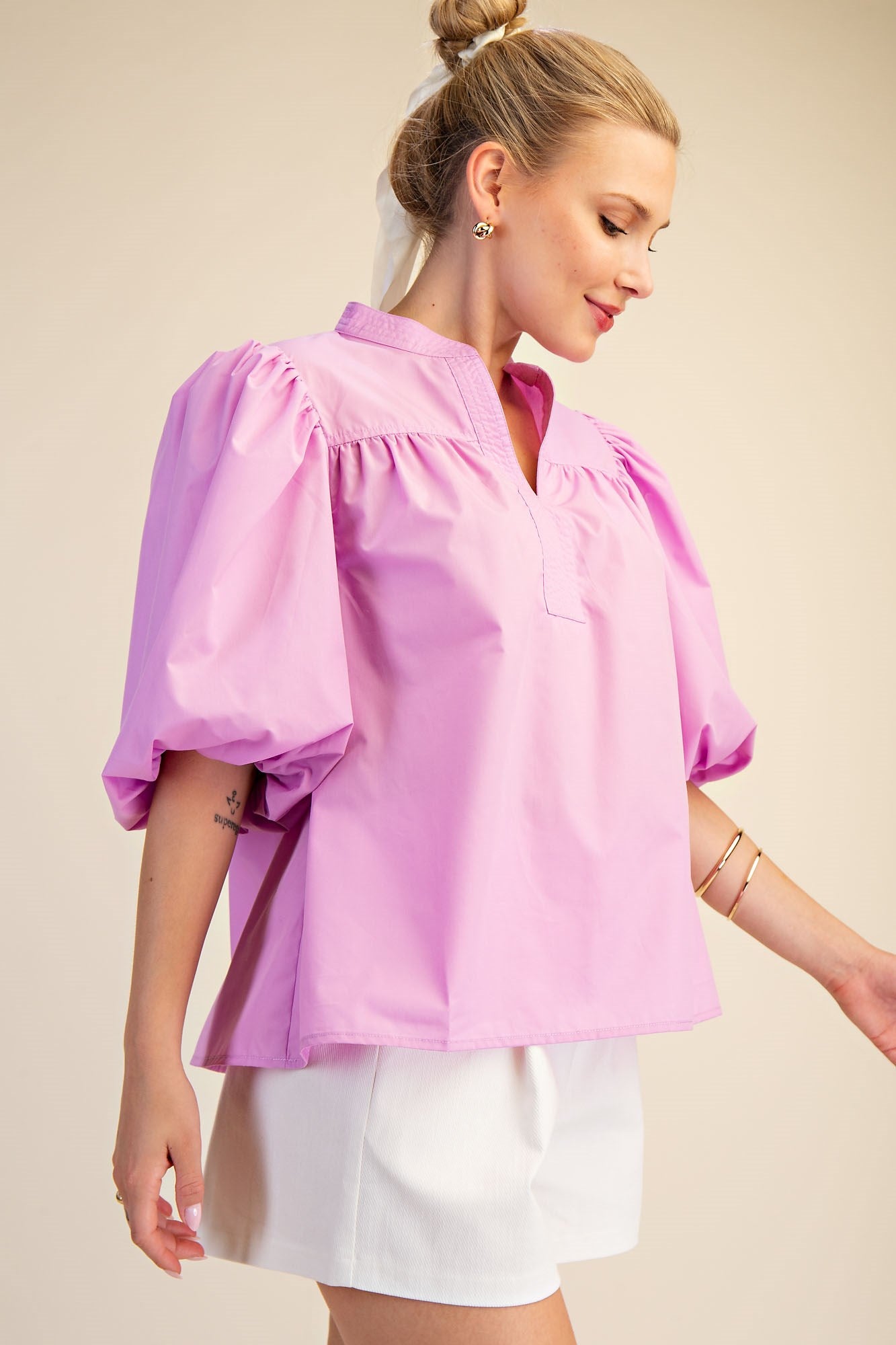 Lilac V-Neck Bubble Sleeve Poplin Top in sizes XS-XL; features v-neck and bubble sleeves.
