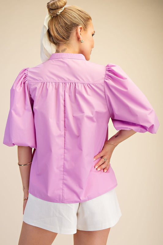 Lilac V-Neck Bubble Sleeve Poplin Top shown; available in sizes XS-XL.
