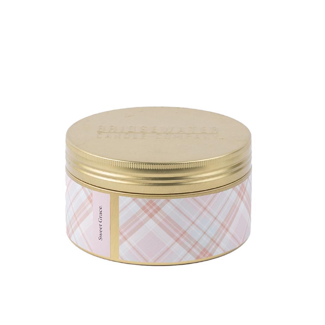 Sweet Grace 3 Wick Tin Candle: round, gold lid, pink plaid label, soy-blend wax. Sizes available: 12 oz and 36 oz.