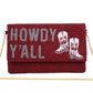 Beaded clutch with red beads, gray “HOWDY Y’ALL” lettering, white cowboy boots, gold chain strap. Size: 10" x 6".