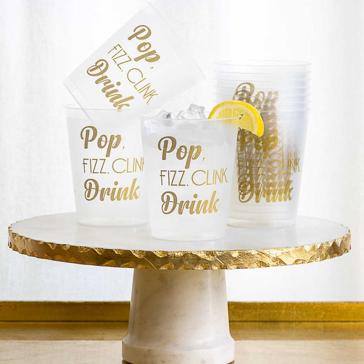 These popular frosted 8 ounce cups that come in a set of 10. This one states pop fizz and clink  drink and gold writing with various fonts