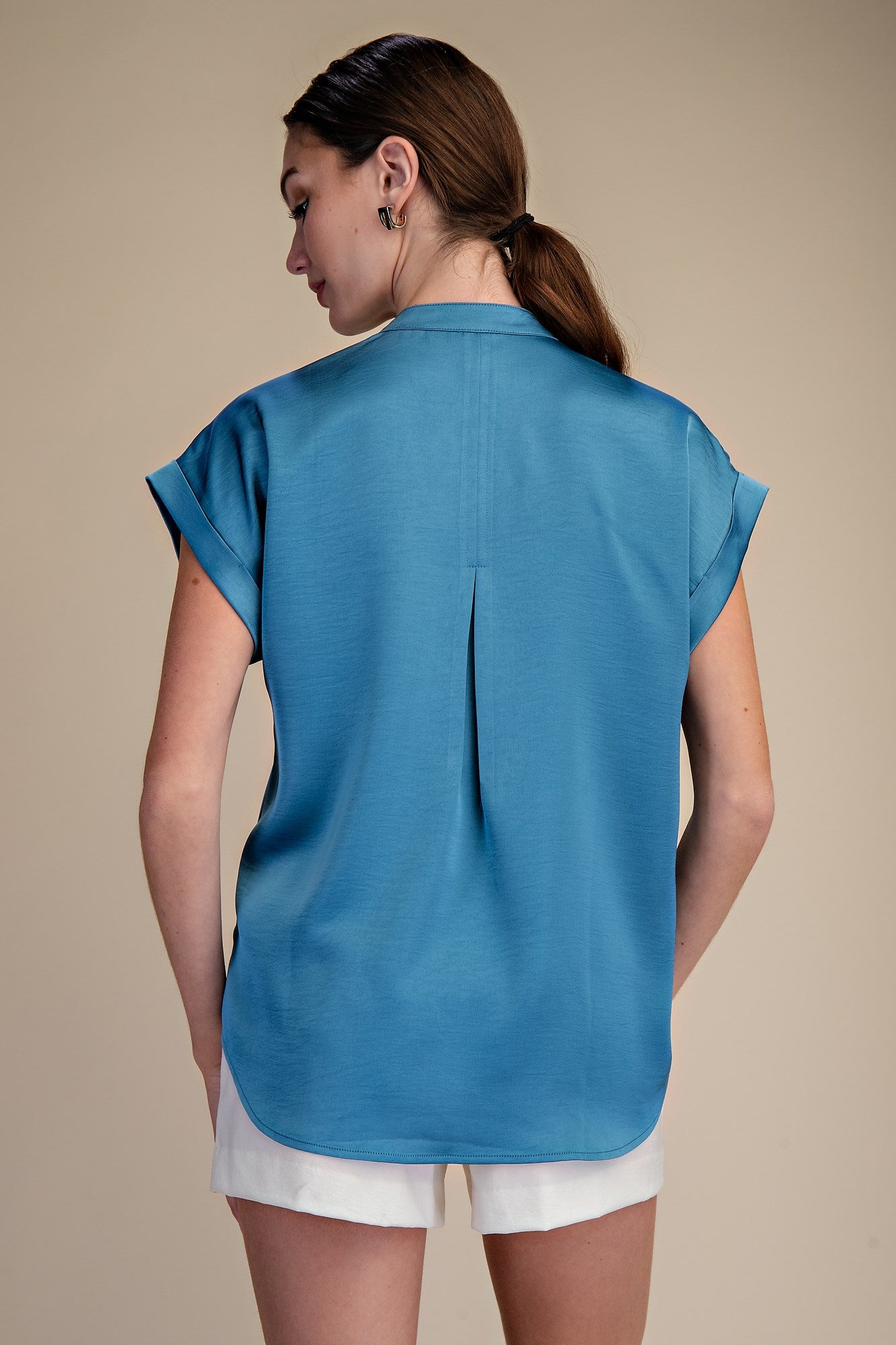 Slate Blue Short-Sleeve Blouse with rolled cuffs and back pleat detail. Available in sizes XS–XL.