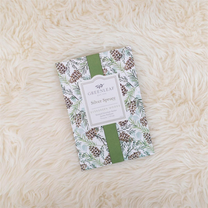 Silver Spruce Large Sachet, 115 ml, featuring a pinecone and evergreen needle pattern and green center ribbon.