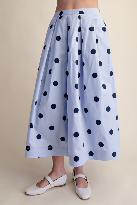 High-waisted blue polka dot pleated midi skirt with pockets. Available in sizes XS-XL.