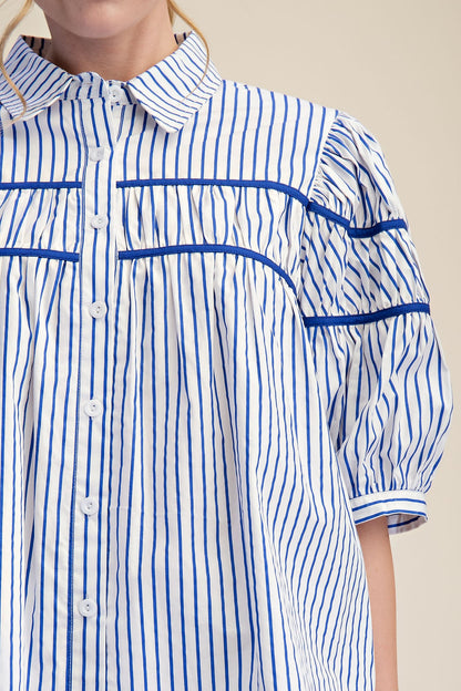 Blue and white striped blouse with puff short sleeves and collar. Available in 2 colors, sizes XS-XL.