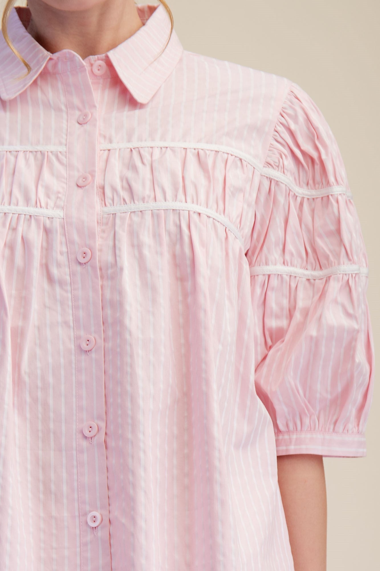 Light pink Gathered Piping Striped Blouse with white stripes, gathered piping, puff sleeves. Available in 2 colors, sizes XS-XL.