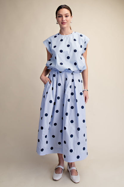 Blue Polka Dot Bubble Top with navy dots, available in sizes XS-XL.