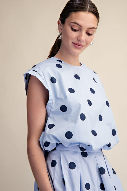 Blue Polka Dot Bubble Top with pleated design, available in sizes XS-XL.