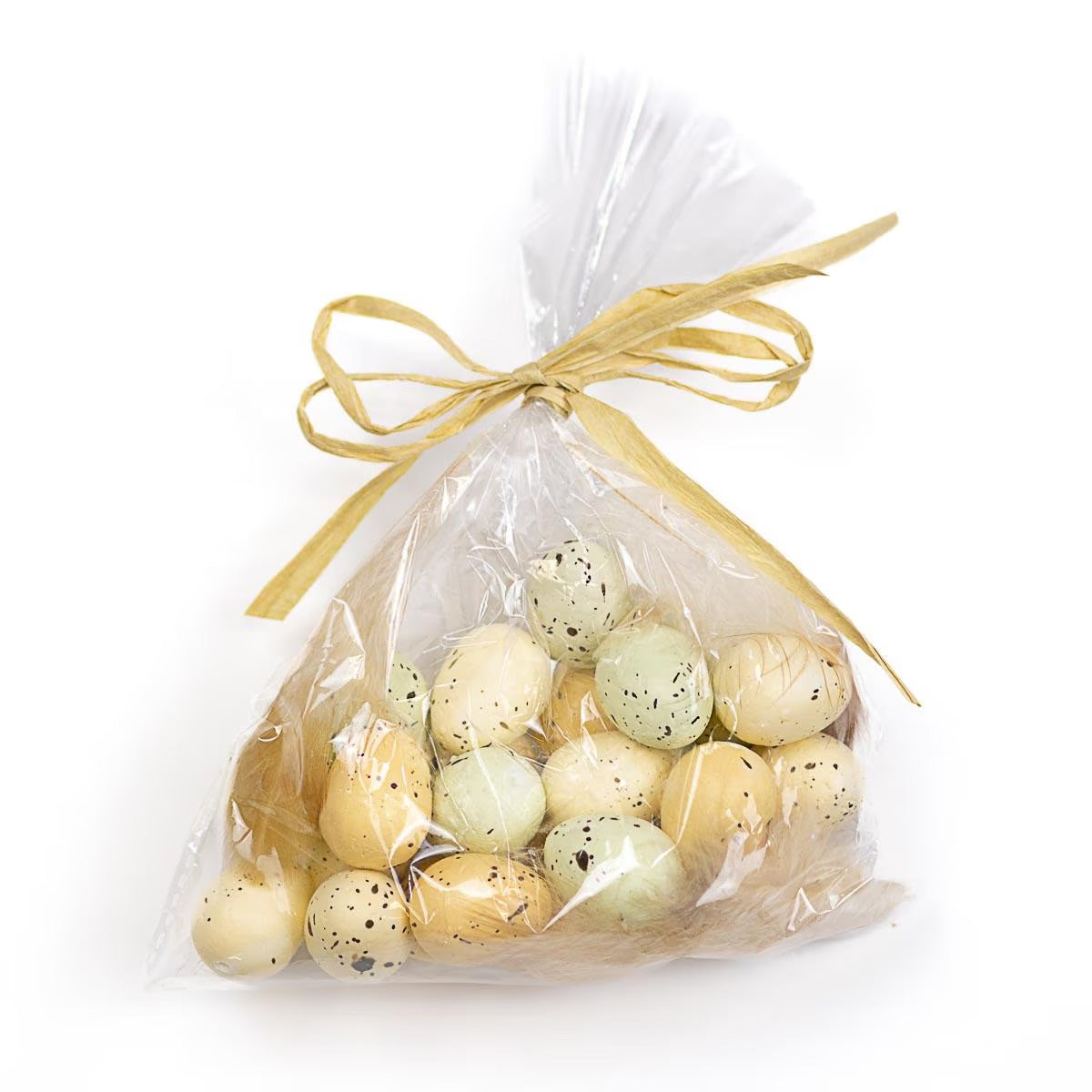 Small speckled Easter eggs in a cellophane bag, tied with cream raffia ribbon. Available sizes: One size.