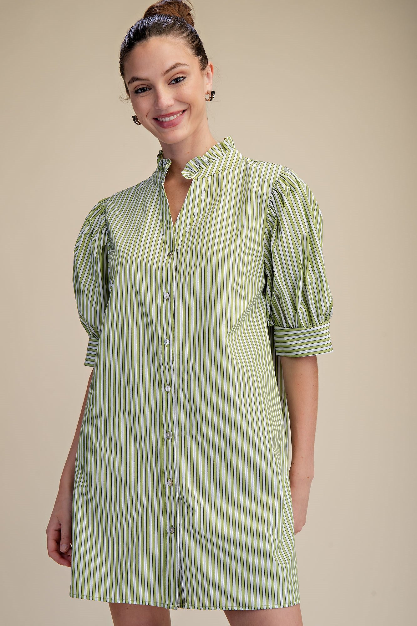 Striped Sage Ruffle Dress with puffed half-sleeves and ruffle neckline. Available in sizes XS–XL.
