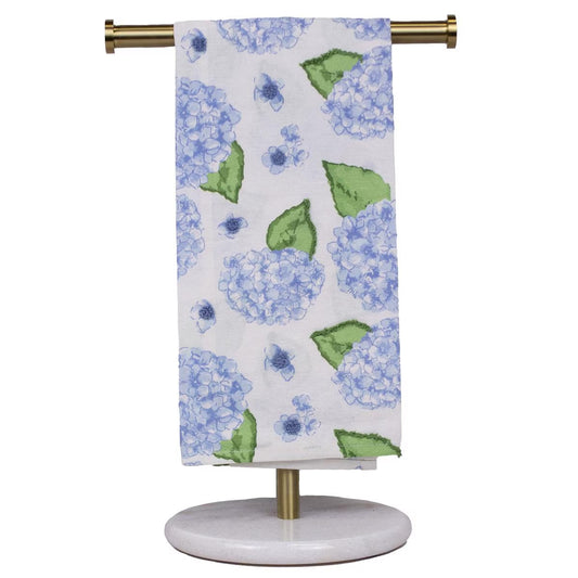 The Hydrangea Hand Towel is a white cotton towel with blue hydrangea flowers and green leaves. Available sizes: standard hand towel size.