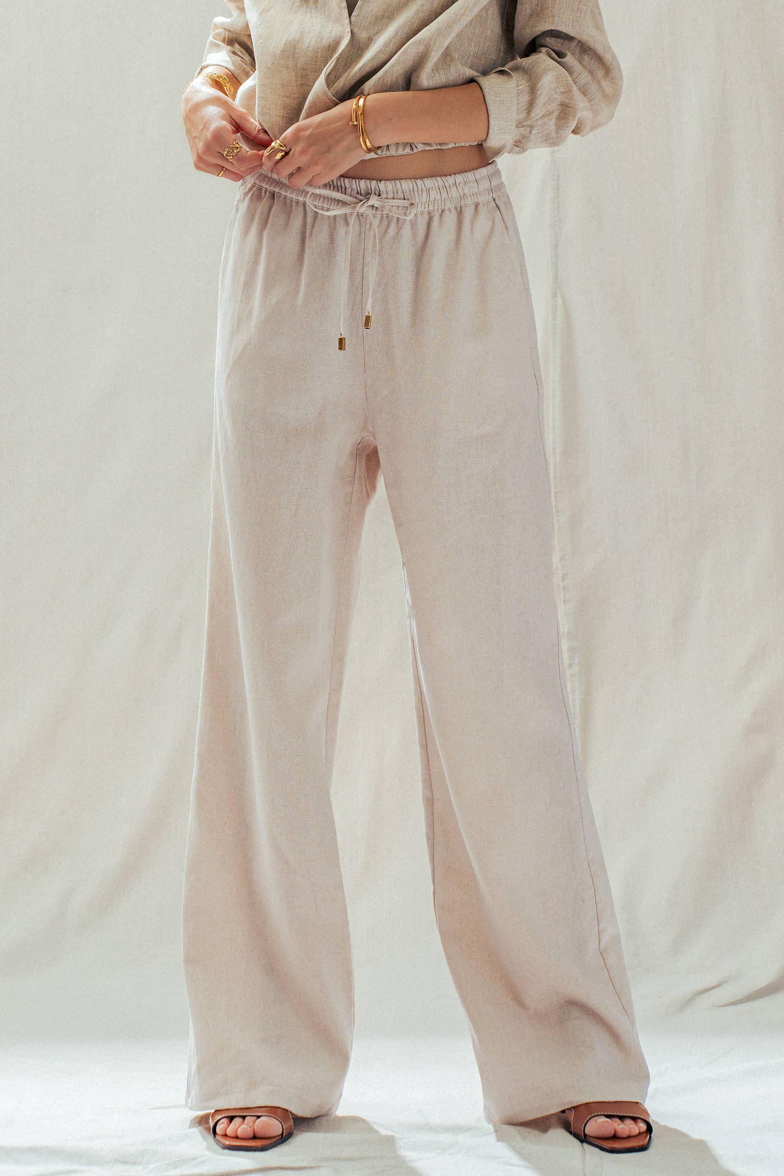 Natural Linen Blend Wide Leg Drawstring Pants in light beige, loose-fit, elastic waistband. Sizes: XS-XL.