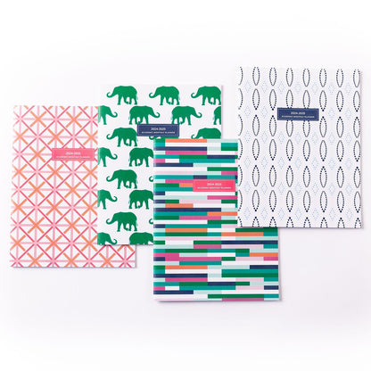 Large academic monthly planner for the year 24 to 25 comes in a variety of patterns one is elephants green elephants the other one is a pink and orange and white abstract pattern with the X in the middle the third one is navy and light blue with oval and diamond pattern the last pattern is a multi pattern and color boxes with larger and smaller boxes