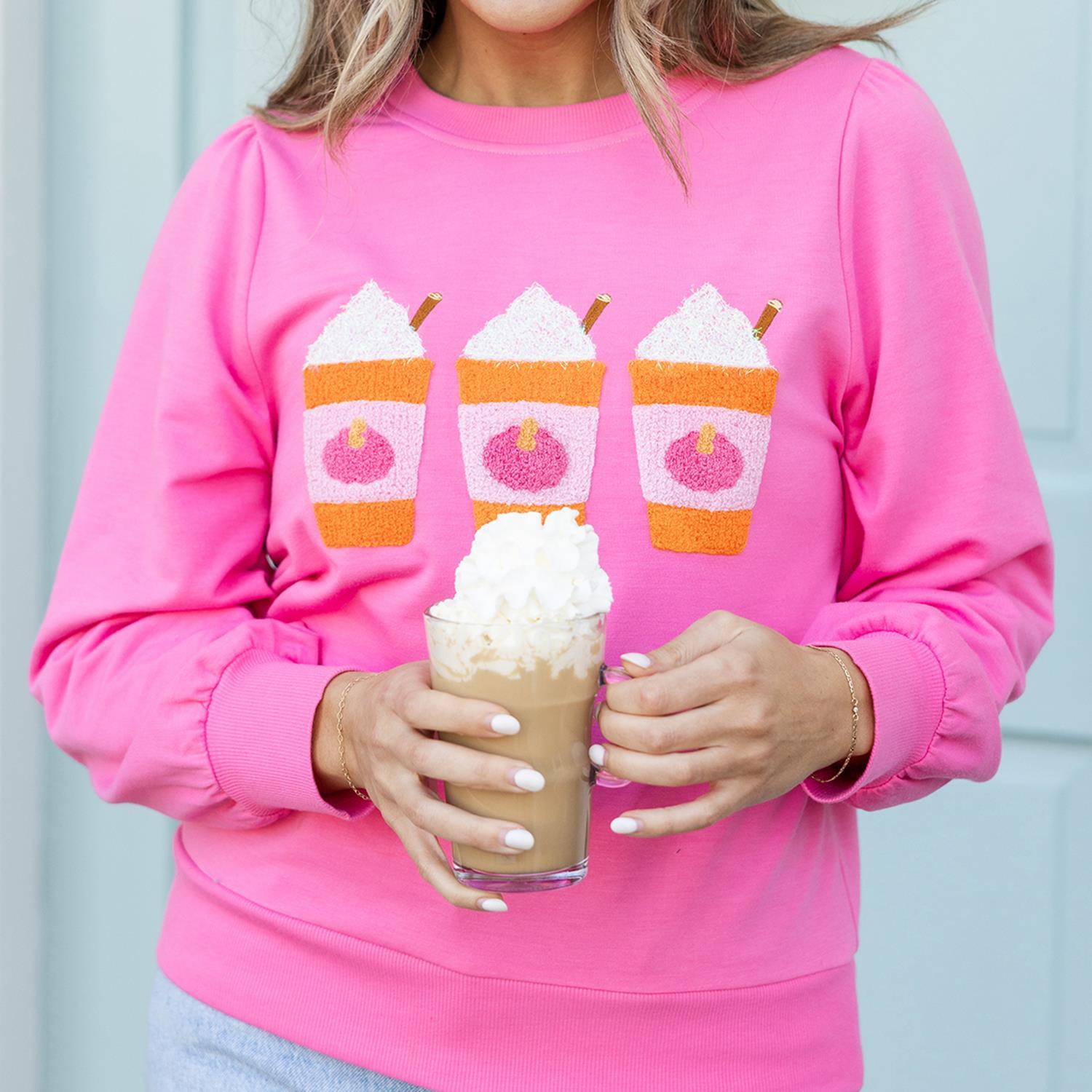 Vivid pink Shelby PSL Sweatshirt with three embroidered whipped coffee cups. Sizes available: S, M, L, XL.