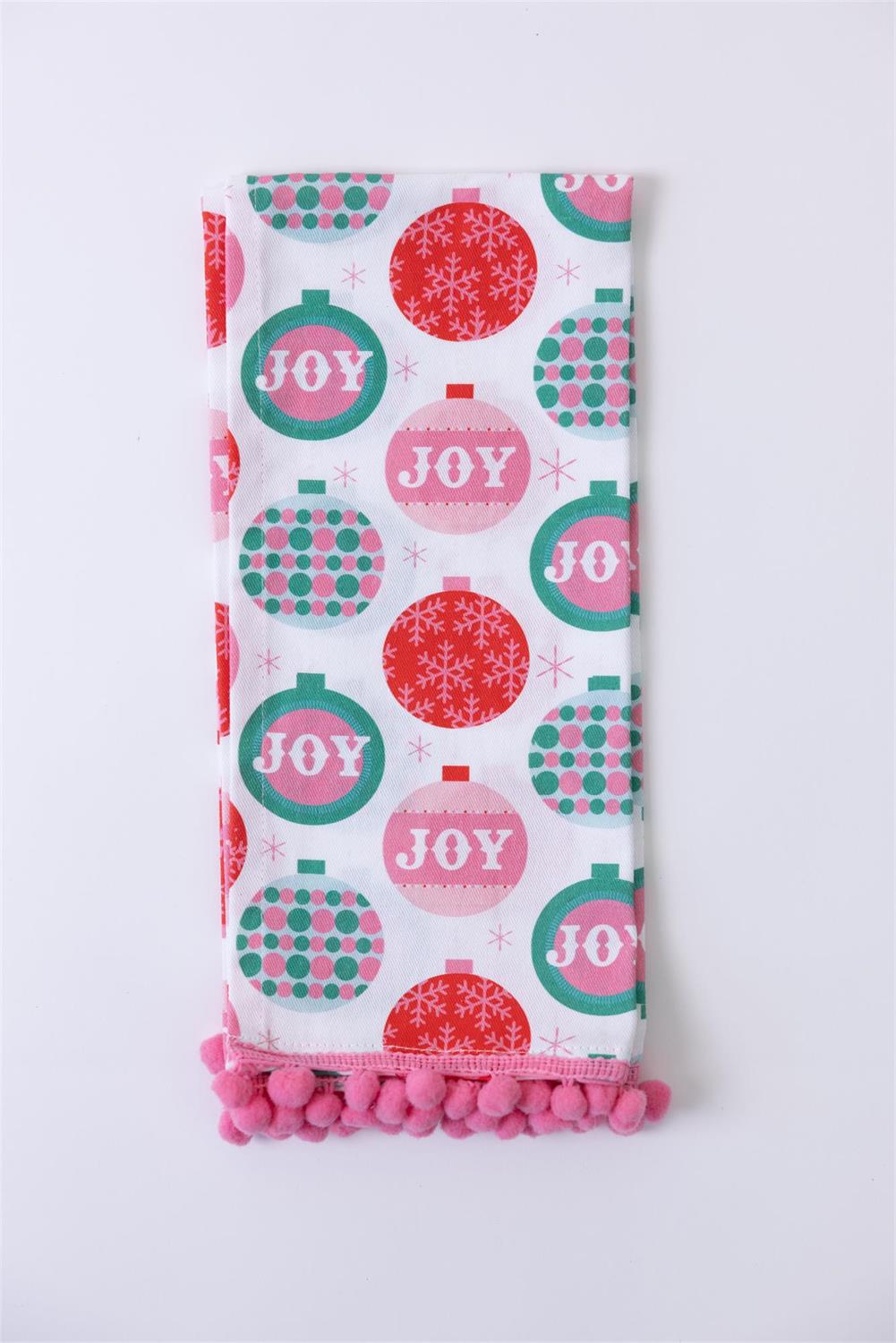 Festive Christmas Tea Towels feature holiday designs with ornaments, polka dots, and snowflakes on a white background, detailed with pink pom-pom trim. Available size: 18" x 28".