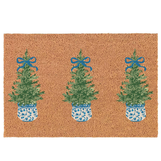 Festive Holiday Door Mat featuring three green Christmas trees in blue and white patterned pots, accented with blue bows on a natural brown coir background. Available in size: 18"x30".