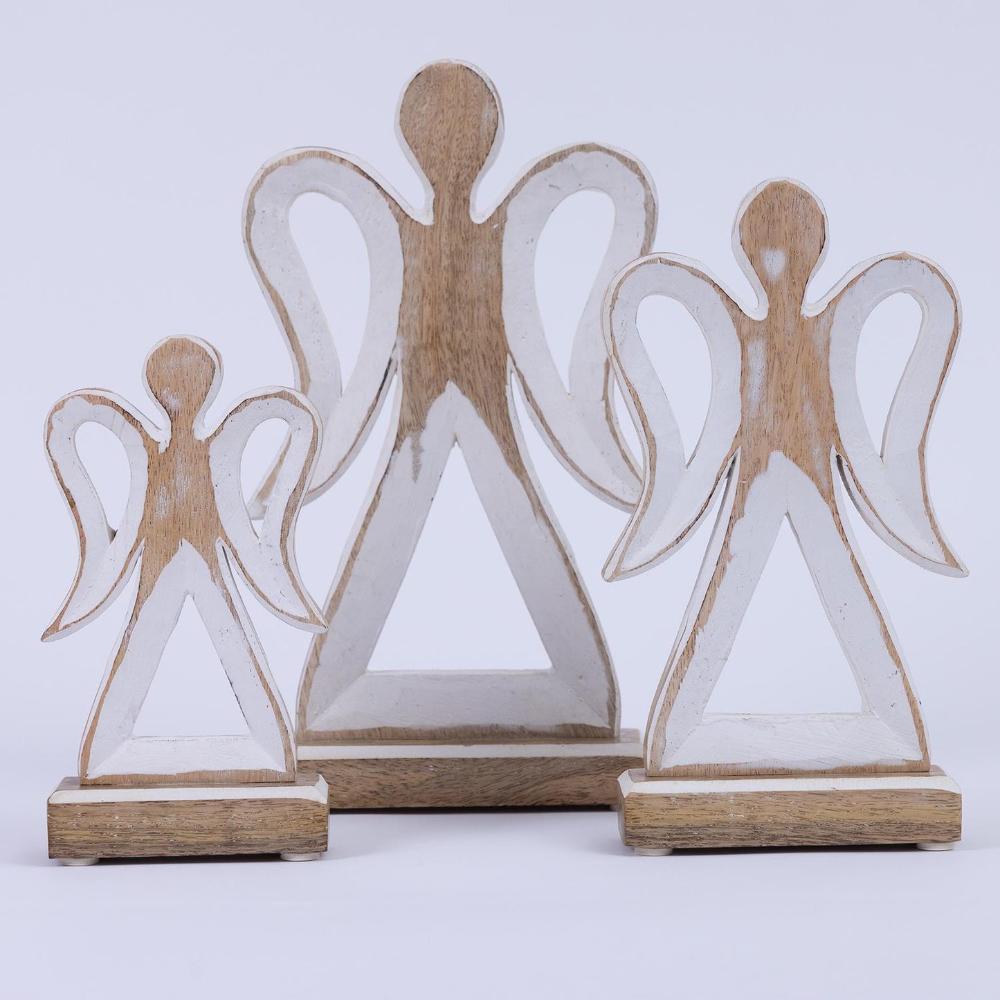 Three Wood Rustic Holy Angel figurines with white accents, perfect for holiday decor, come in small, medium, and large sizes. They feature a minimalist design with wings and triangular bodies.