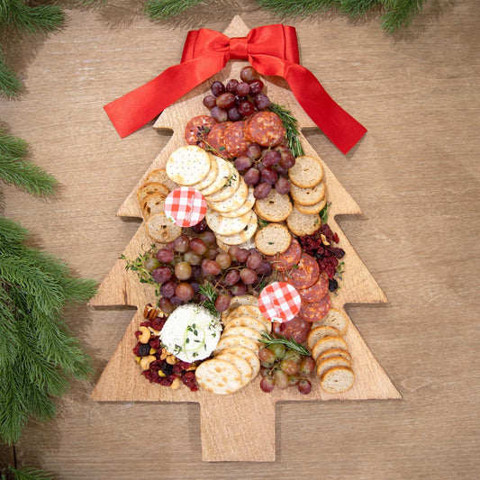 Wood Tree Board with Bow: Festive centerpiece adorned with a red bow and green branches. Perfect for displaying Christmas treats. Sizes available: Standard 18"x12".