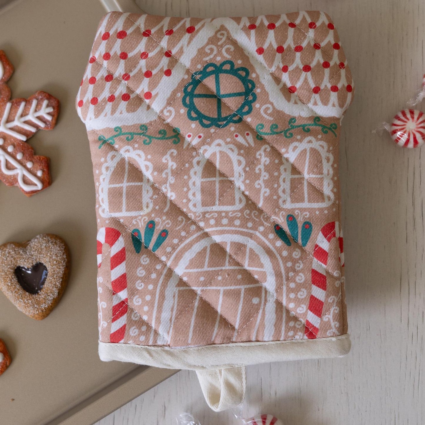 Christmas Oven Mitt: Quilted, gingerbread house shape, adorned with candy cane stripes and festive designs. Sizes: One size available.