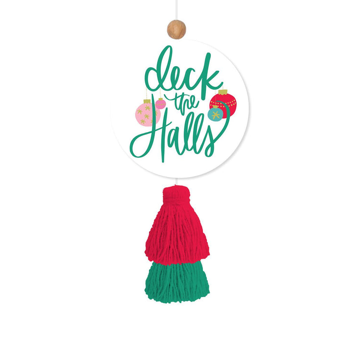 Round cinnamon-scented holiday car air freshener featuring “deck the halls” text, colorful ornaments, and a red and green yarn tassel.