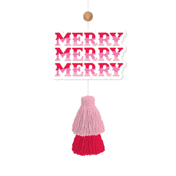Rectangular cinnamon pine Holiday Car Air Freshener with “MERRY MERRY MERRY” in pink and red, featuring a two-tone pink and red yarn tassel.
