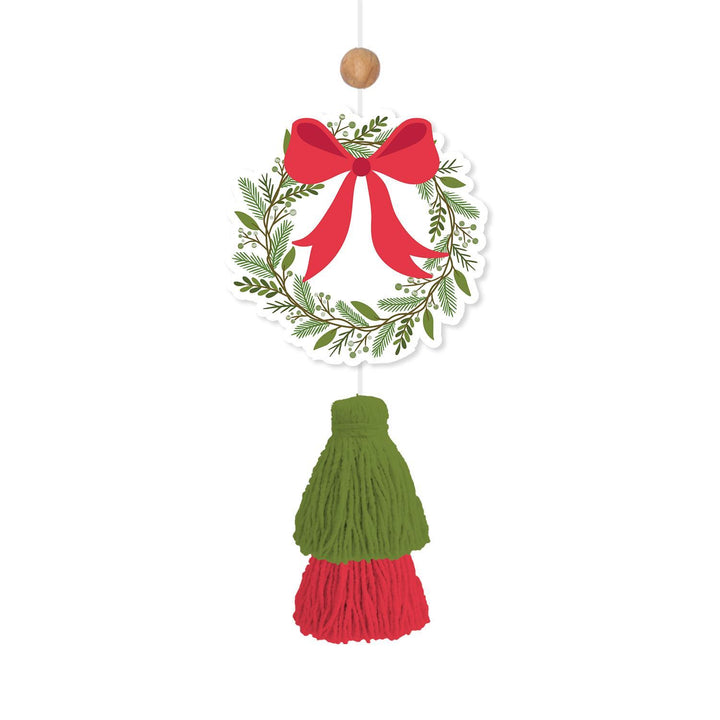 Holiday Christmas wreath car air freshener with red bow and green and red tassel.